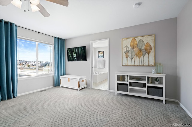 interior space with ceiling fan and light carpet