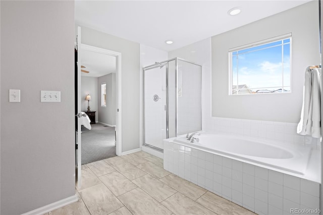 bathroom with ceiling fan and shower with separate bathtub