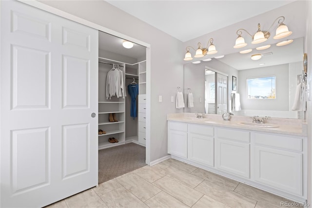 bathroom with tile patterned flooring and vanity