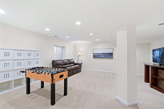 rec room with light colored carpet