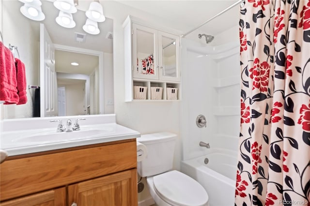 full bathroom featuring vanity, toilet, and shower / tub combo with curtain