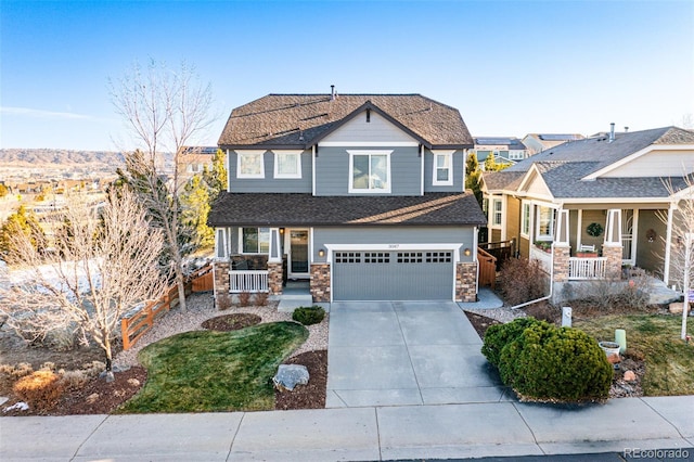 view of front of property with a porch and a garage