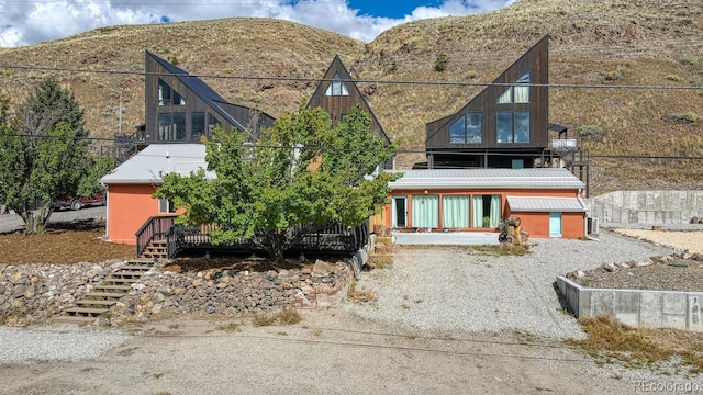 exterior space featuring a deck with mountain view