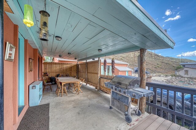 view of patio / terrace with a mountain view and grilling area