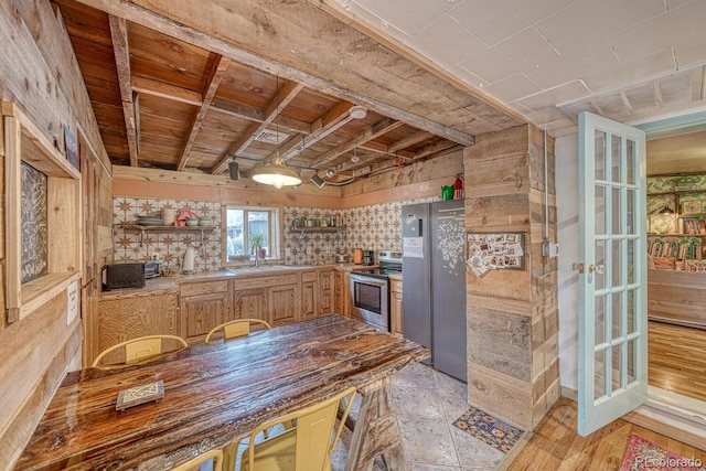 kitchen featuring sink, light wood-type flooring, and stainless steel appliances