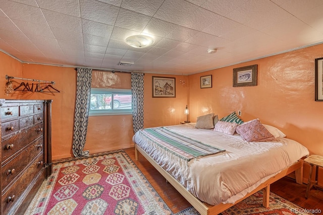 bedroom featuring hardwood / wood-style flooring