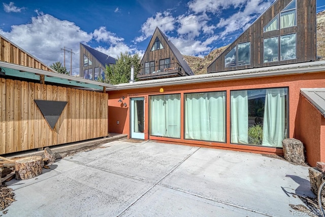 rear view of house with a patio