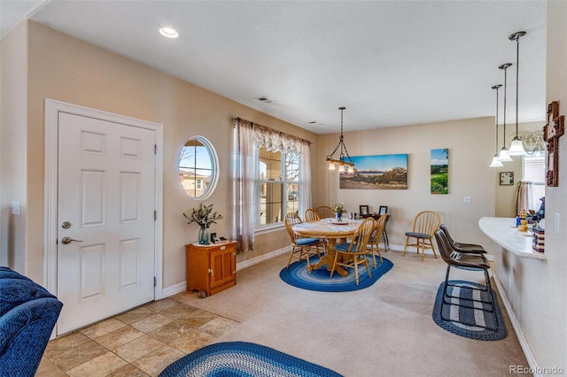 dining space featuring carpet floors, visible vents, baseboards, and recessed lighting