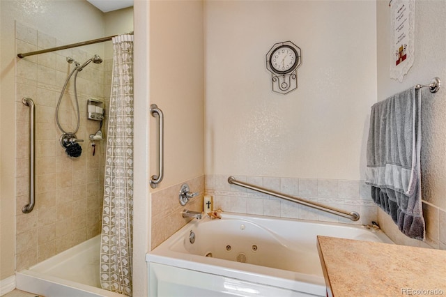 bathroom with a jetted tub and a tile shower