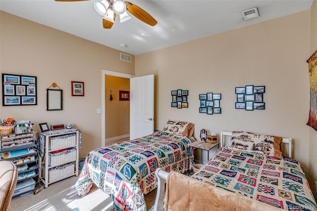 bedroom with ceiling fan, carpet, and visible vents