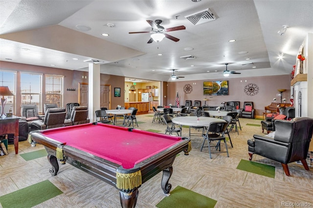 game room featuring recessed lighting, visible vents, vaulted ceiling, and light carpet