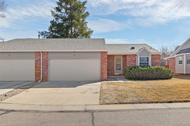 view of front facade with an attached garage, brick siding, driveway, roof with shingles, and a front yard