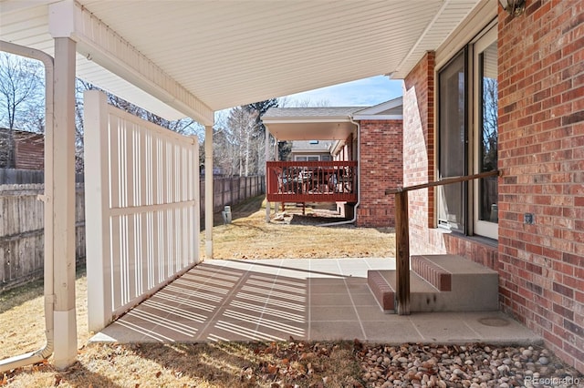 view of patio / terrace featuring entry steps and fence