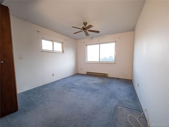 spare room featuring carpet flooring, a ceiling fan, and a baseboard radiator