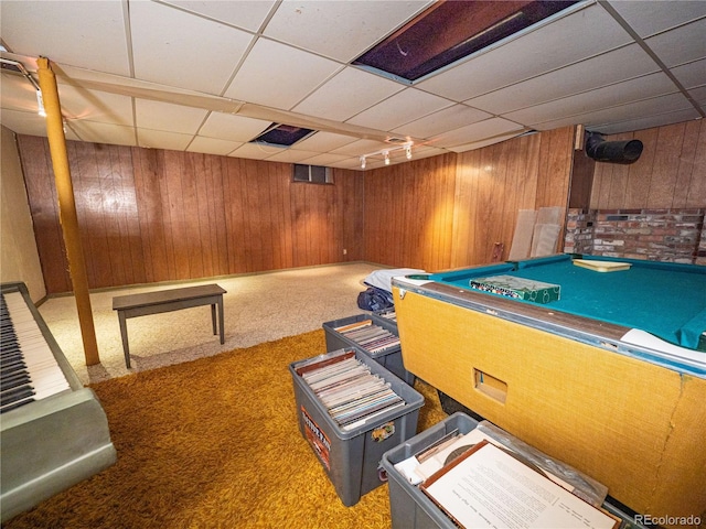 game room with wooden walls, carpet, rail lighting, a paneled ceiling, and billiards