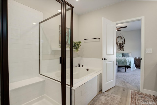 ensuite bathroom featuring a garden tub, a ceiling fan, a shower stall, ensuite bath, and wood finished floors