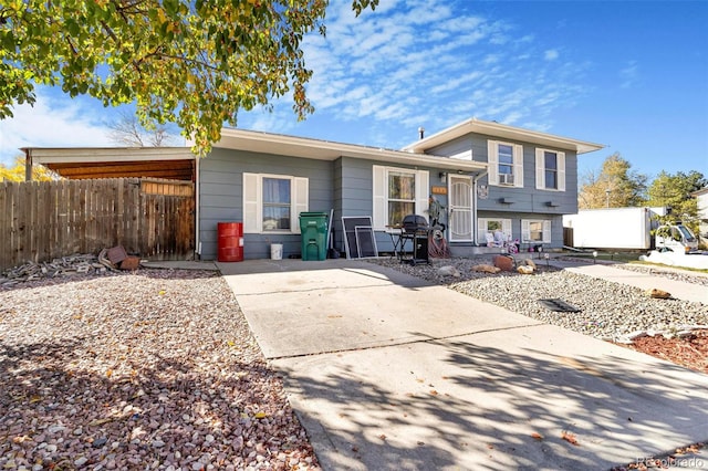 split level home featuring a carport