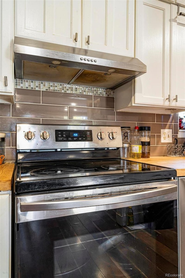 kitchen featuring white cabinetry, stainless steel range with electric cooktop, and decorative backsplash