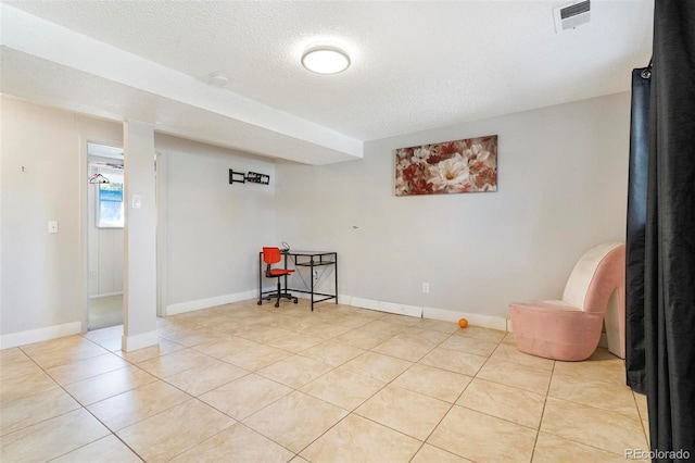 interior space featuring a textured ceiling