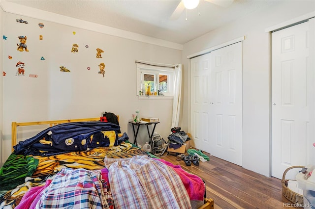 bedroom featuring hardwood / wood-style flooring and ceiling fan