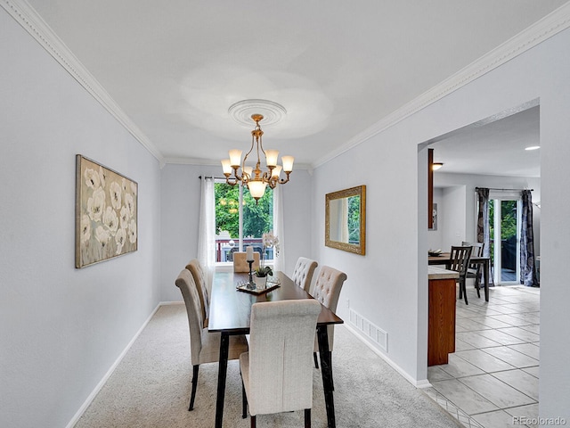 8838 S Dudley St, Littleton, CO 80128 - dining room featuring crown molding, plenty of natural light, a chandelier, baseboards, and light colored carpet