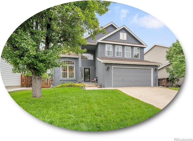 8838 S Dudley St, Littleton, CO 80128 - traditional home featuring stucco siding, driveway, and an attached garage