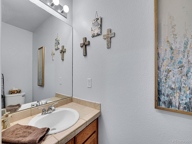8838 S Dudley St, Littleton, CO 80128 - bathroom featuring vanity and toilet