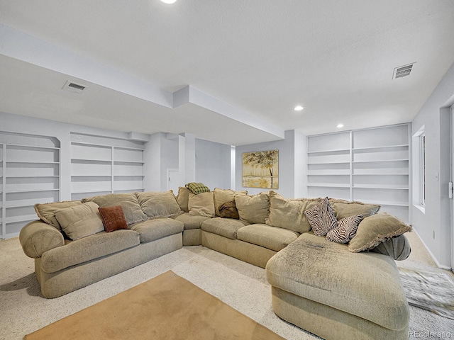 8838 S Dudley St, Littleton, CO 80128 - living area featuring built in shelves, carpet floors, recessed lighting, and baseboards