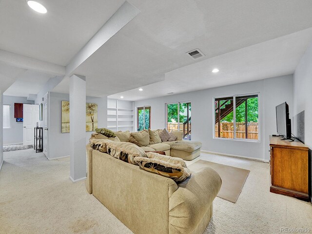 8838 S Dudley St, Littleton, CO 80128 - living area featuring light colored carpet, recessed lighting, and baseboards