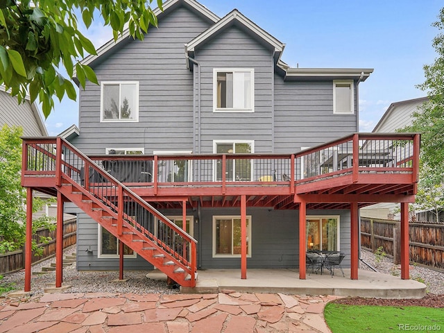 8838 S Dudley St, Littleton, CO 80128 - rear view of house featuring a patio area, stairs, and a wooden deck
