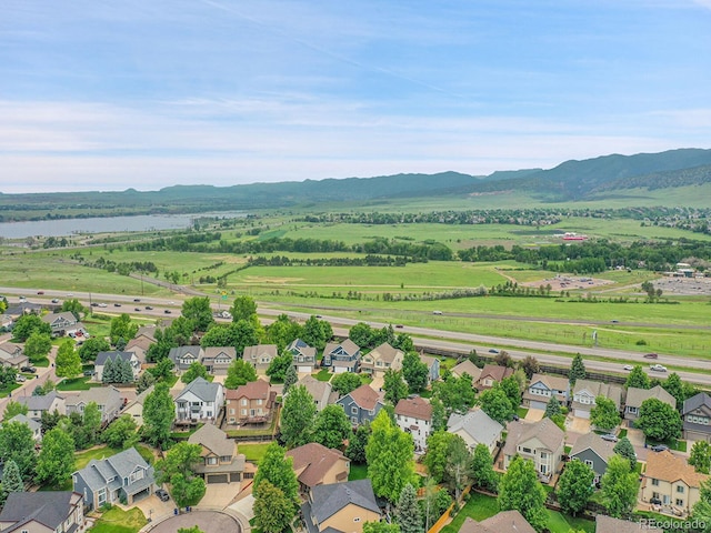 8838 S Dudley St, Littleton, CO 80128 - aerial view of residential area with a water and mountain view