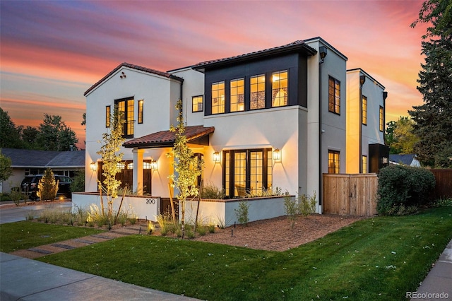 view of front of property with stucco siding and a tile roof