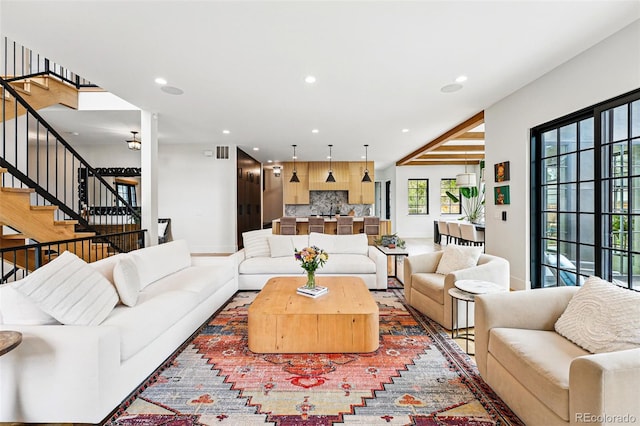 living room with recessed lighting and stairway