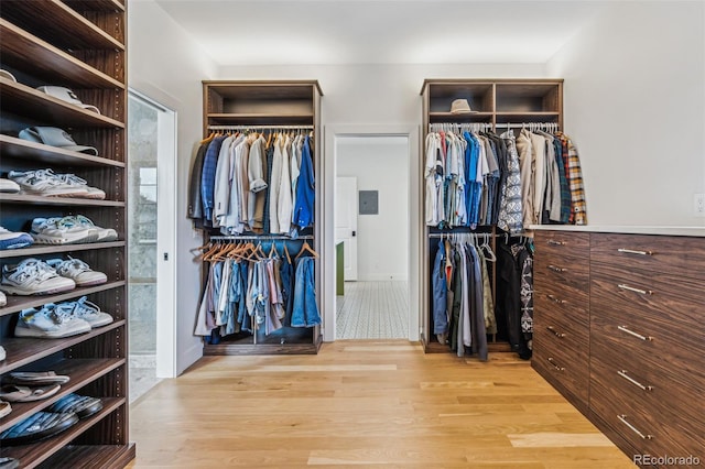 walk in closet featuring light wood-style flooring