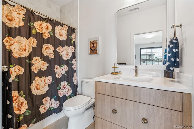 full bathroom with toilet, vanity, and a shower with curtain