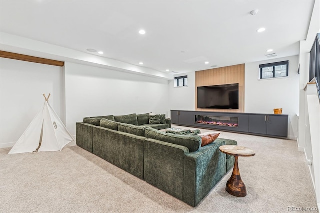 carpeted living room with recessed lighting and healthy amount of natural light