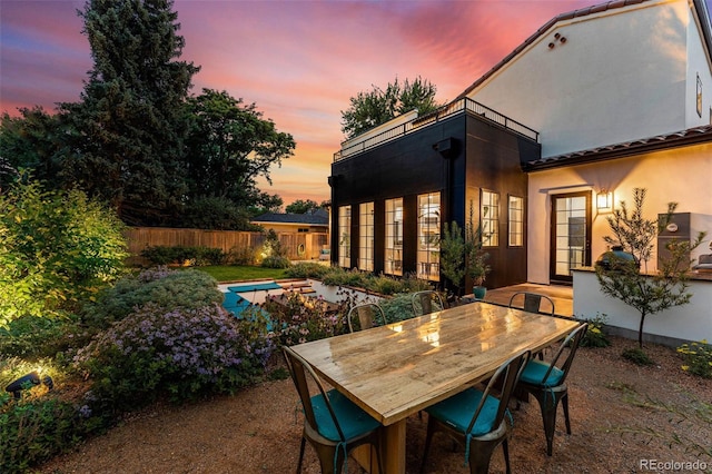 patio terrace at dusk with fence