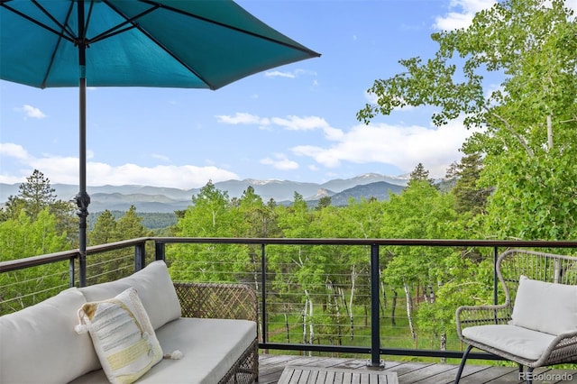 12653 Rancho Ct, Conifer, CO 80433 - balcony with a mountain view and a sunroom