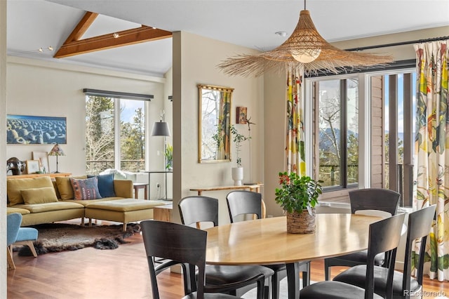 12653 Rancho Ct, Conifer, CO 80433 - dining room featuring wood finished floors and vaulted ceiling