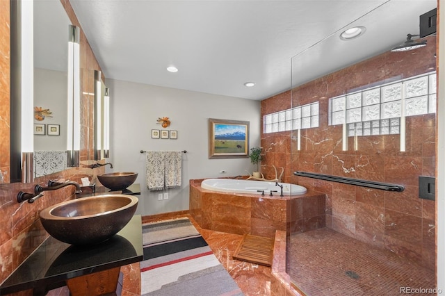 12653 Rancho Ct, Conifer, CO 80433 - bathroom with a bath, a stall shower, recessed lighting, and vanity