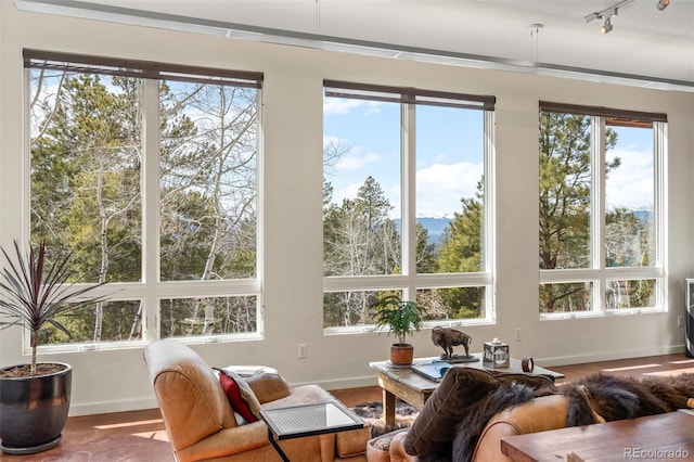 12653 Rancho Ct, Conifer, CO 80433 - sunroom / solarium featuring plenty of natural light and track lighting