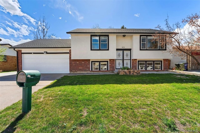 split foyer home featuring driveway, brick siding, a garage, stucco siding, and a front lawn