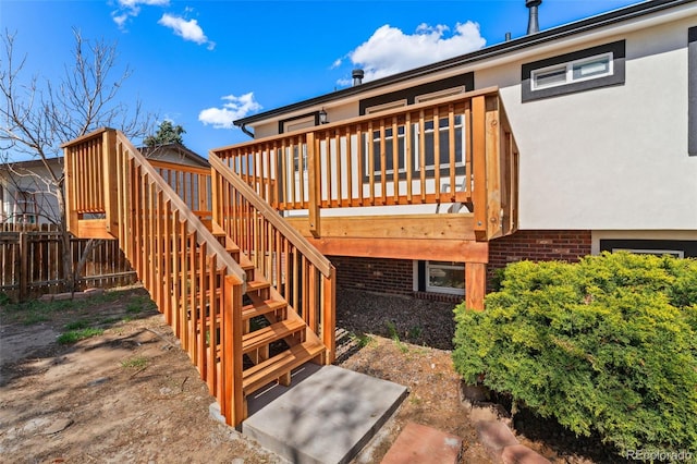 deck with fence and stairs