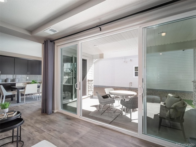 entryway with light hardwood / wood-style flooring