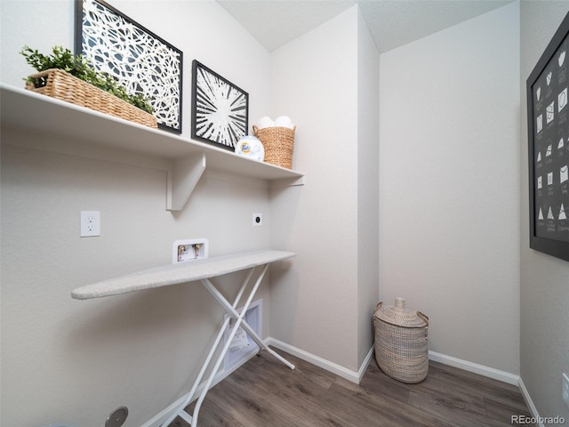 washroom with hookup for an electric dryer, washer hookup, and dark hardwood / wood-style flooring