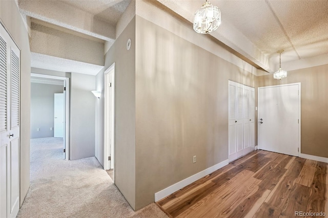 7865 E Mississippi Ave Unit 1504, Denver, CO 80247 - entrance foyer with a chandelier, a textured ceiling, and wood finished floors