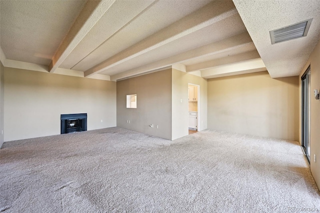 7865 E Mississippi Ave Unit 1504, Denver, CO 80247 - unfurnished living room with beam ceiling, carpet floors, a fireplace, and a textured ceiling