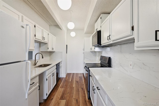 7865 E Mississippi Ave Unit 1504, Denver, CO 80247 - kitchen featuring freestanding refrigerator, stainless steel electric range oven, backsplash, dark wood-style flooring, and a textured ceiling