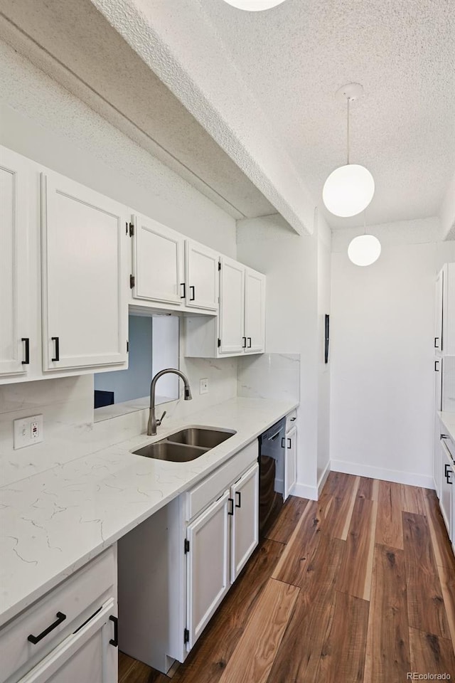 7865 E Mississippi Ave Unit 1504, Denver, CO 80247 - kitchen featuring black dishwasher, a textured ceiling, white cabinets, dark wood-type flooring, and light stone counters