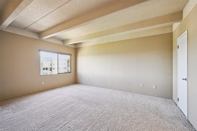 7865 E Mississippi Ave Unit 1504, Denver, CO 80247 - spare room with carpet, beamed ceiling, and a textured ceiling